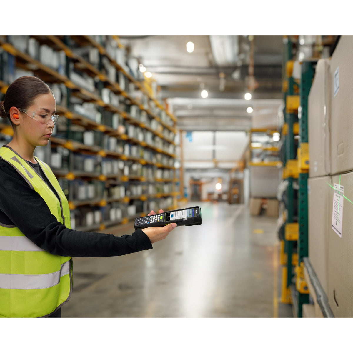 Zebra MC3450 rugged 5G keypad mobile computer, straight shooter, 38-key function numeric keypad (MC345B-3S1P63SS-A6) – in use in a warehouse