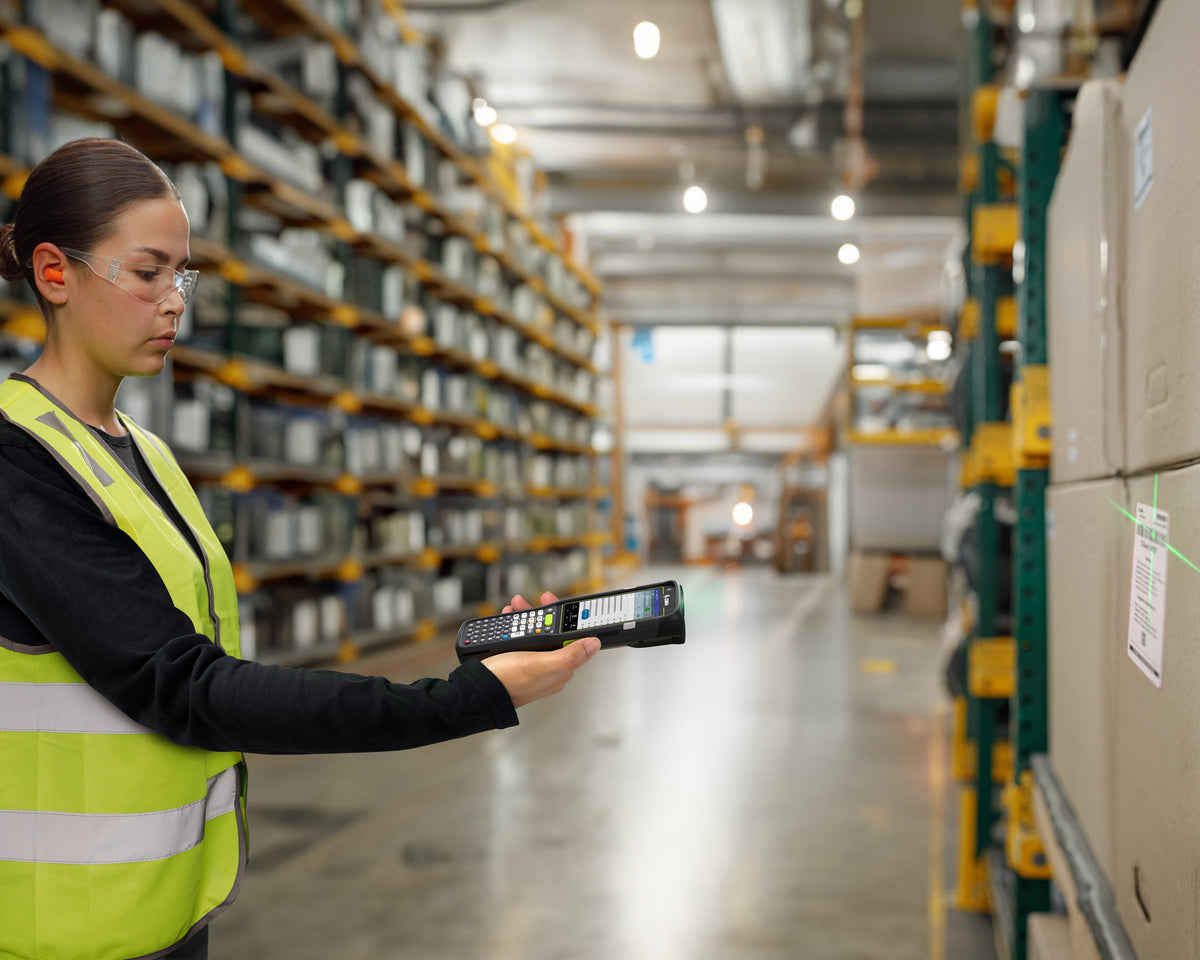Zebra MC3450 rugged 5G keypad mobile computer, straight shooter, 38-key function numeric keypad (MC345B-3S1P63SS-A6) – in use in a warehouse