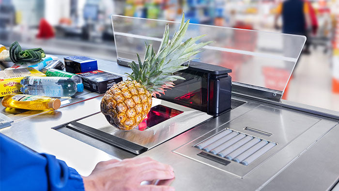 Datalogic Magellan 9550i bi-optic in-counter scanner (957011001) – in use at a staffed checkout